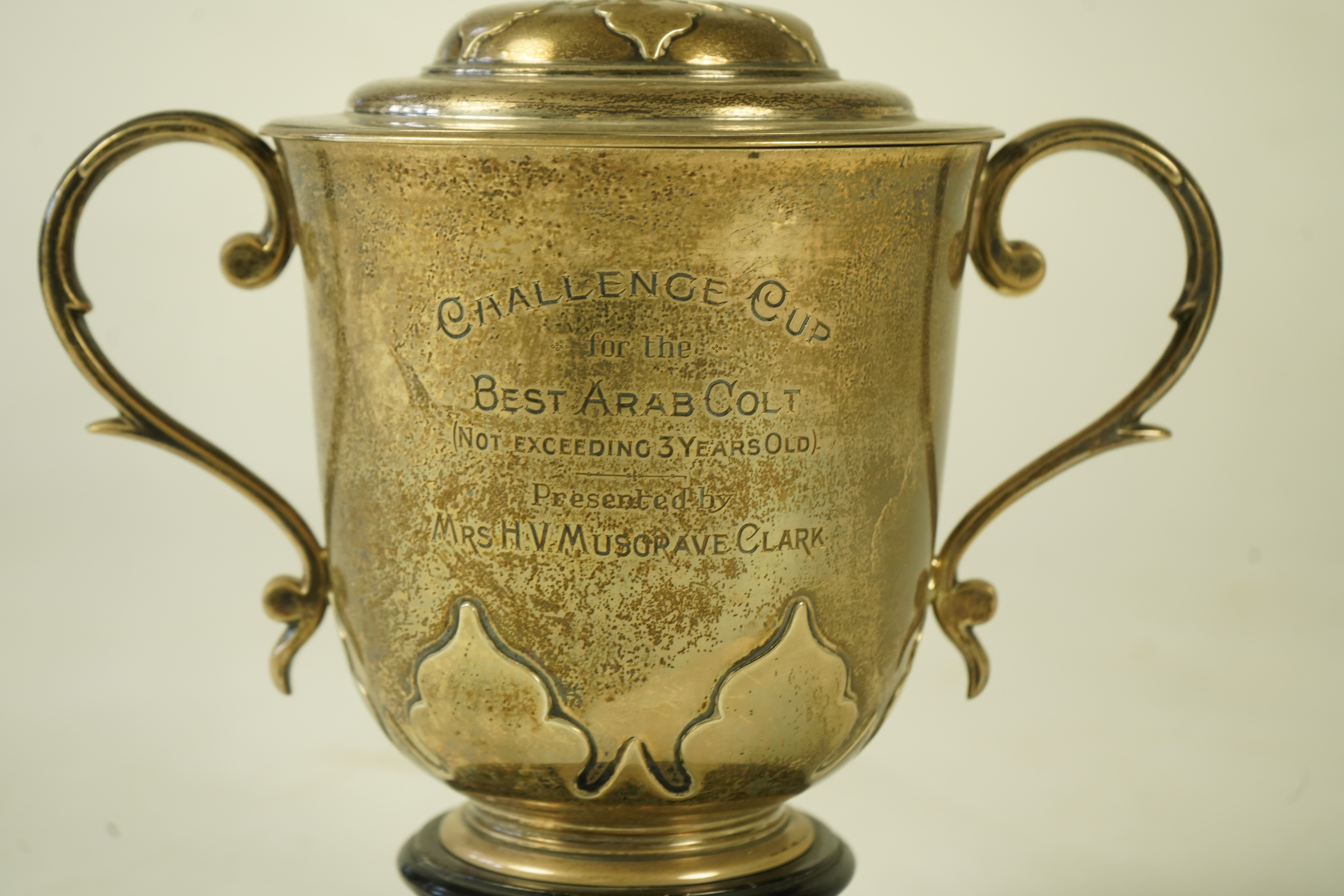 A George V silver two handled presentation cup and cover by Johnson, Walker & Tolhurst, with later engraved horse racing inscription relating to 'The Arab Horse Society Challenge Cup for the Best Arab Colt'